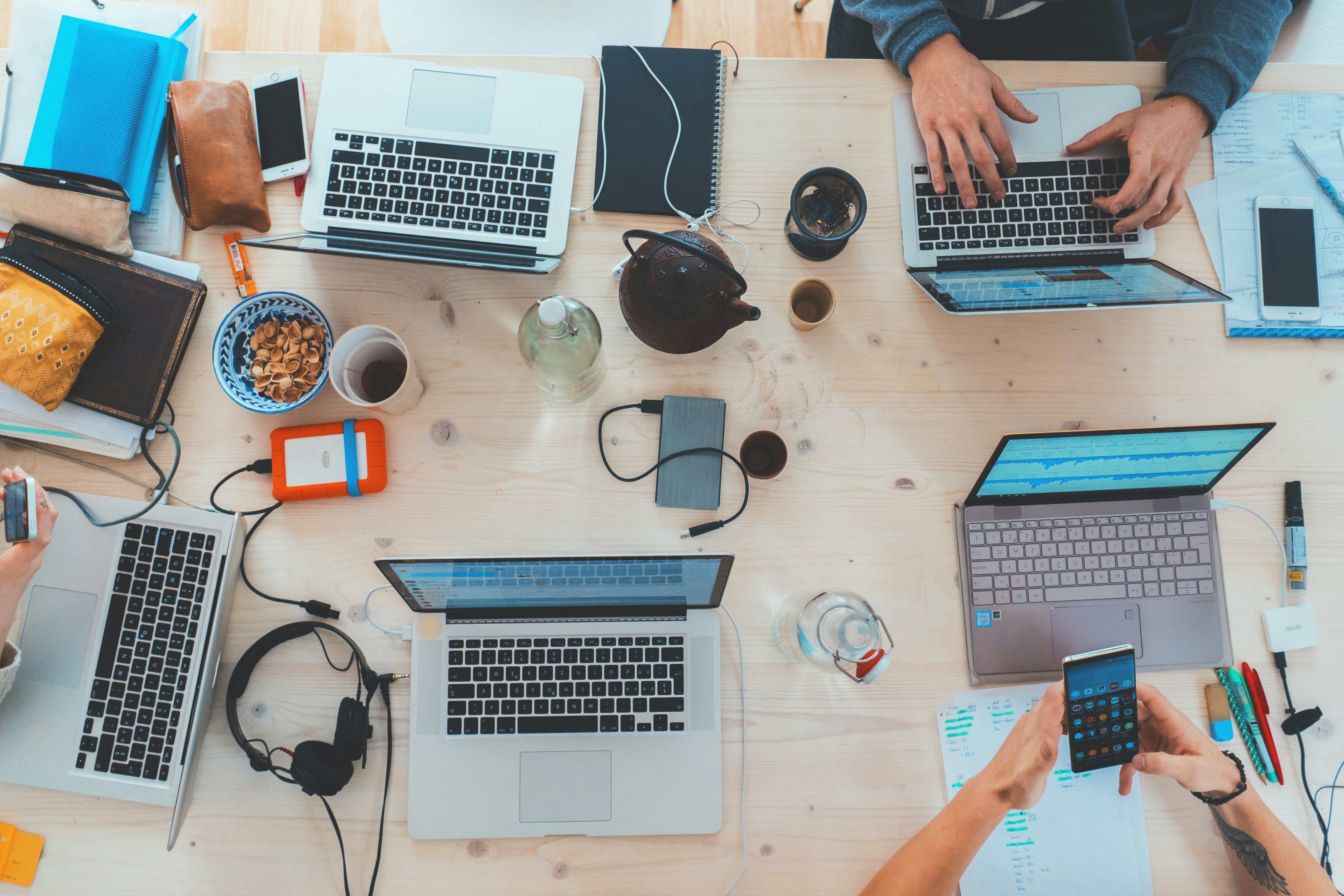 Fivecubix office room table with laptop and gadgets